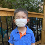 Kid wearing standard reusable mask